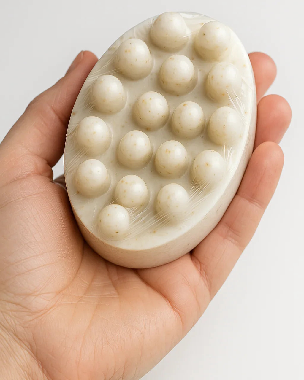 Oatmeal and goat's milk soap by shovota, showcasing a creamy texture and natural ingredients for sensitive skin.