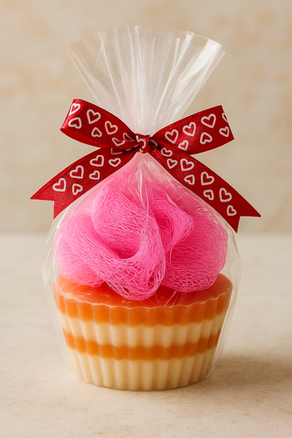 Exfoliating Cupcake Soap by SHOVOTA displayed with a fluffy bath puff, showcasing its colorful, cupcake-inspired design.