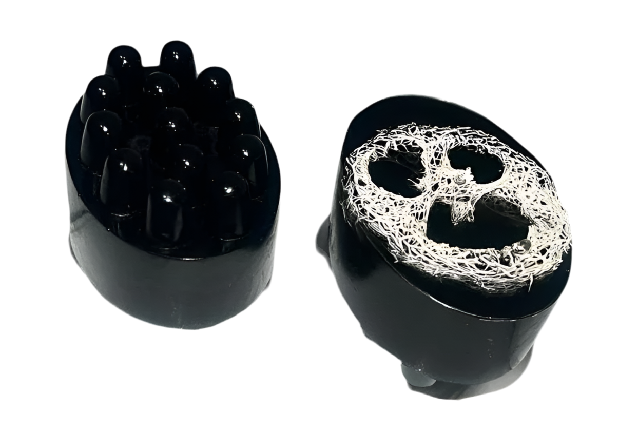 Activated charcoal soap bar with exfoliating sponge for deep pore cleansing, by shovota, displayed on a clean surface.
