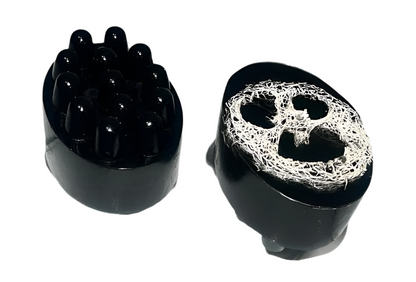Activated charcoal soap bar with exfoliating sponge for deep pore cleansing, by shovota, displayed on a clean surface.