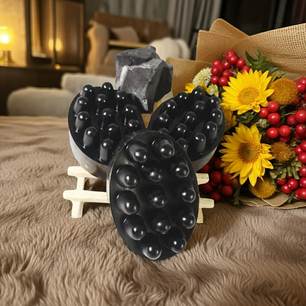 Activated charcoal soap by shovota with an exfoliating sponge for deep pore cleansing and detoxification.